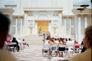 A play is performed on the steps of the Temple.