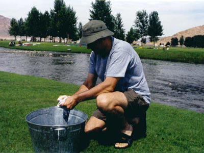 Doing the wash in a bucket